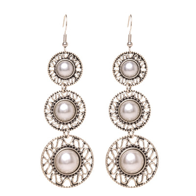 Three pearl rings dangling earrings
