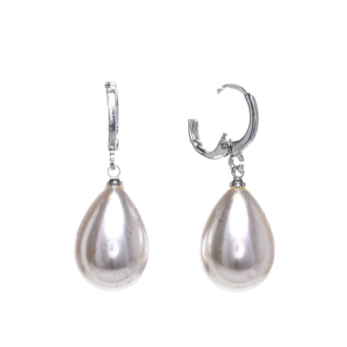 Droplet-shaped pearl earrings hanging from a ring