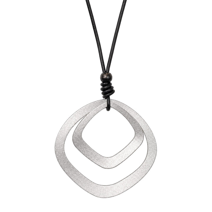 A long black necklace with two silver square pendants