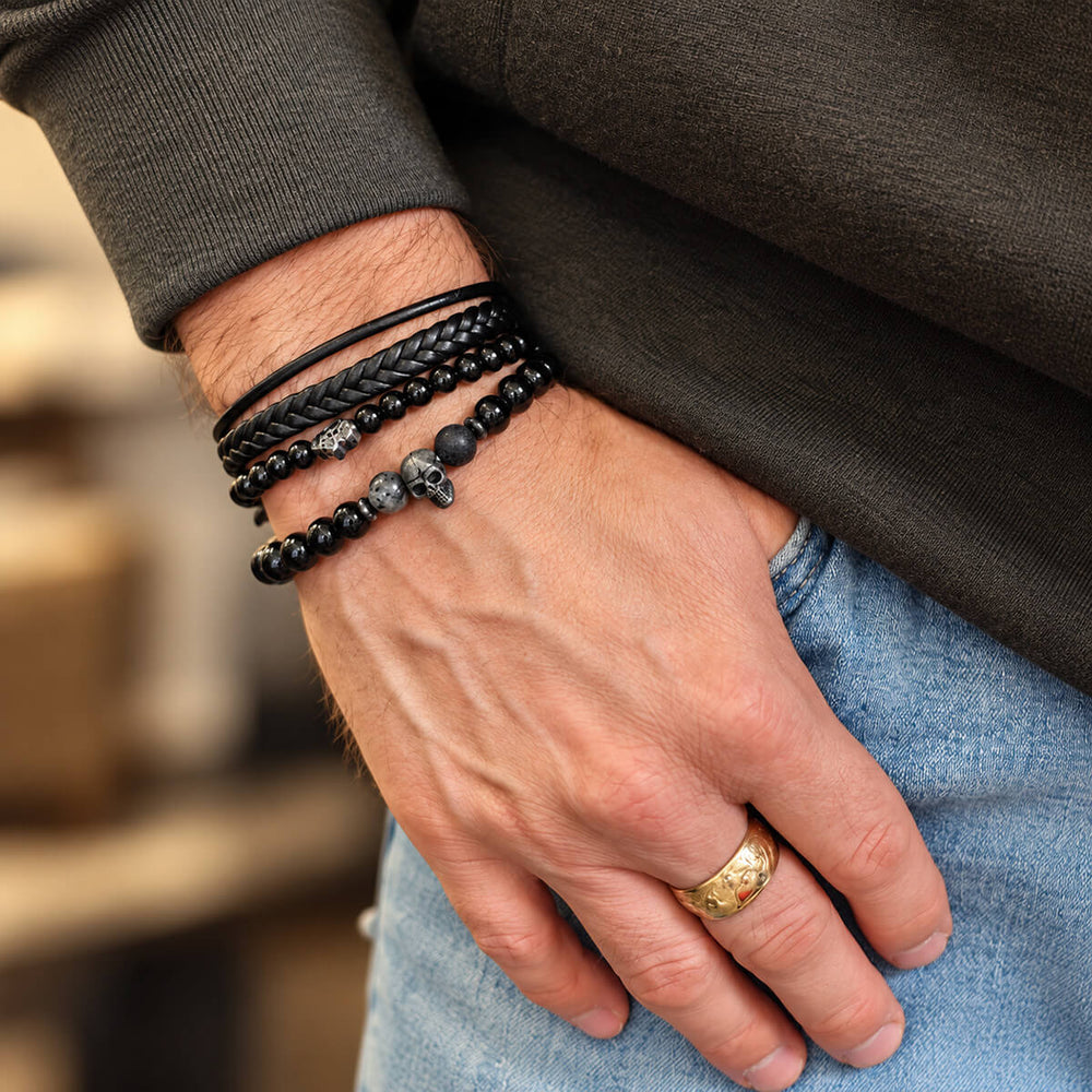 Black Skull Hamsa Bracelet Set on a Man's Wrist