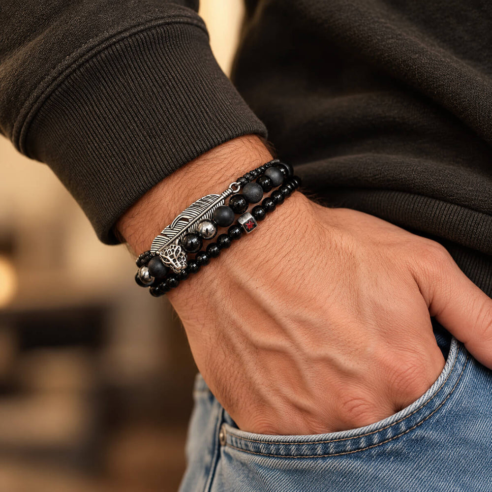 Black Feather Skull bracelet set on a man's wrist