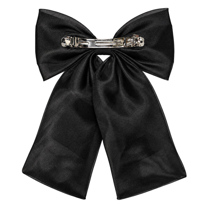 A sleek, lace-like hair bow with a clasp