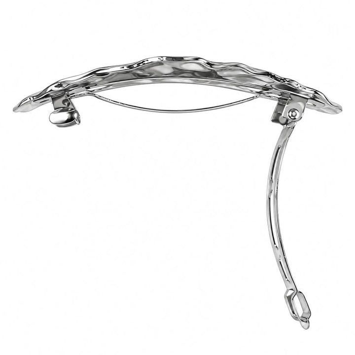 Curved, oval-shaped hair clip—hand-forged with a shiny finish