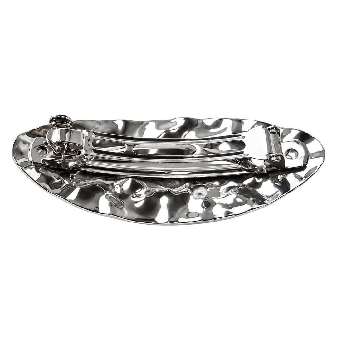 Curved, oval-shaped hair clip—hand-forged with a shiny finish