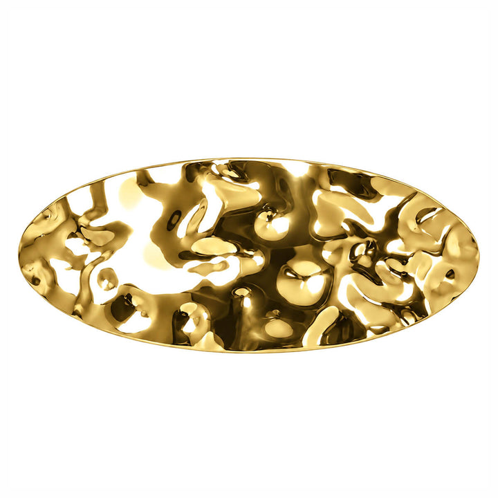 Curved, oval-shaped hair clip—hand-forged with a shiny finish