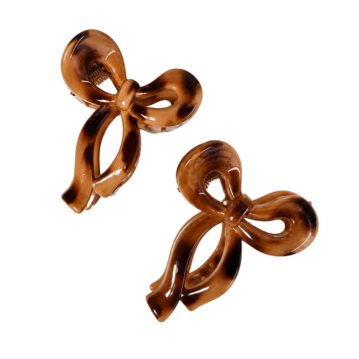 Small plastic bow-tie and shark-tooth hair clips, set of 2