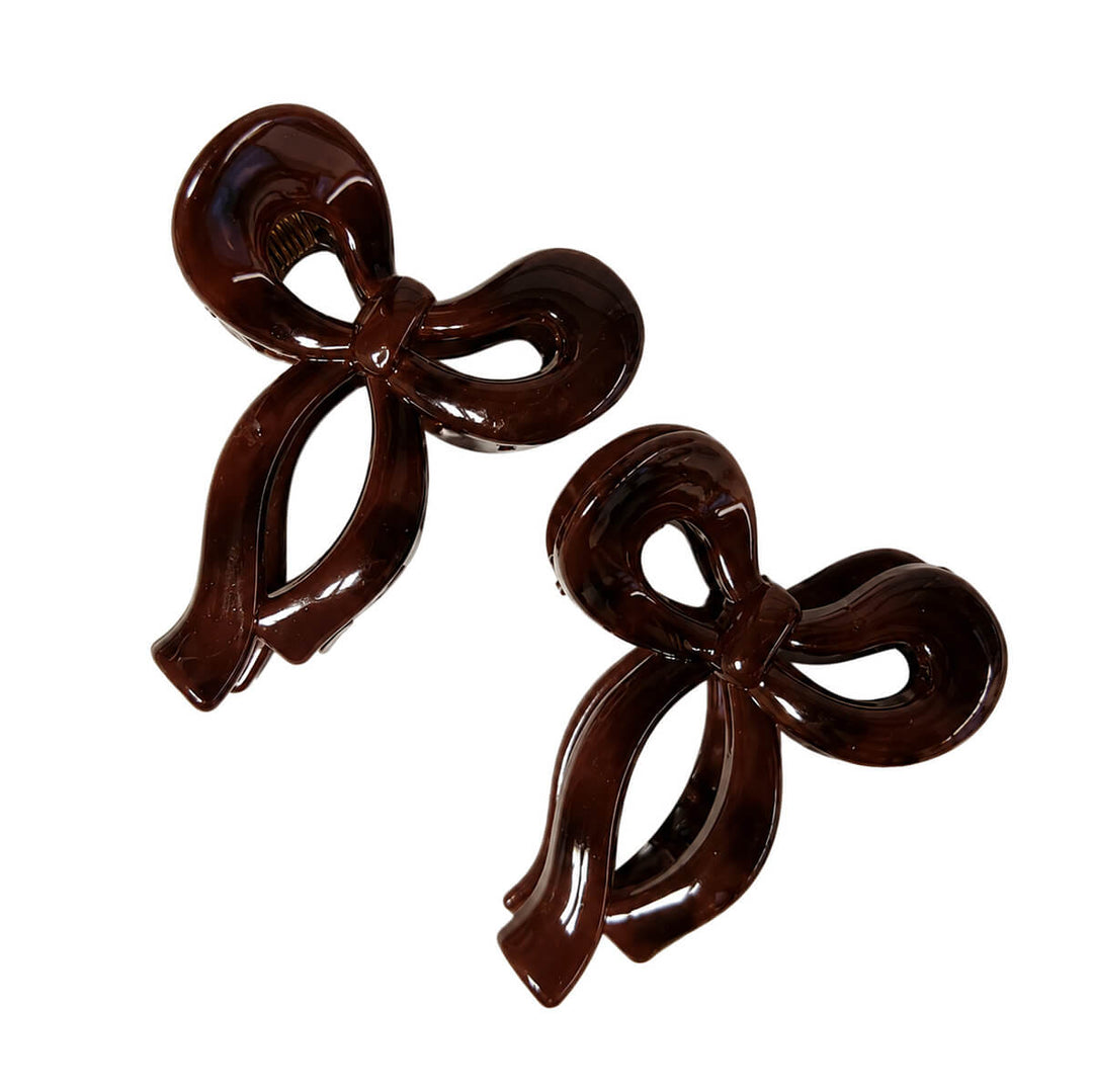 Small plastic bow-tie and shark-tooth hair clips, set of 2