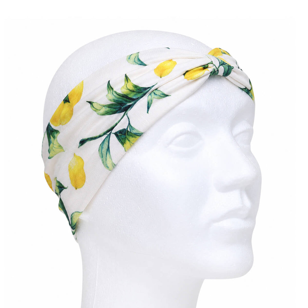 Wide headband with a lemon pattern and a bow