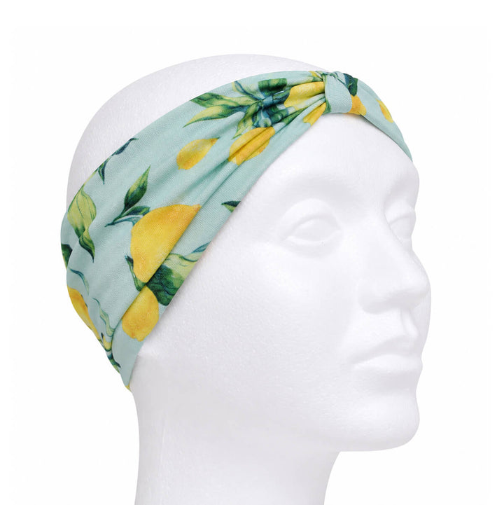 Wide headband with a lemon pattern and a bow