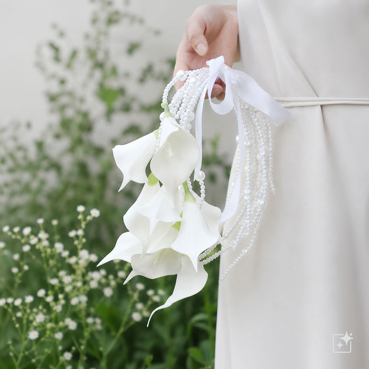 A bridal bouquet with a pearl arch – white artificial flowers