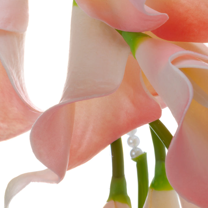 A calla lily bridal bouquet with a peach-colored artificial flower