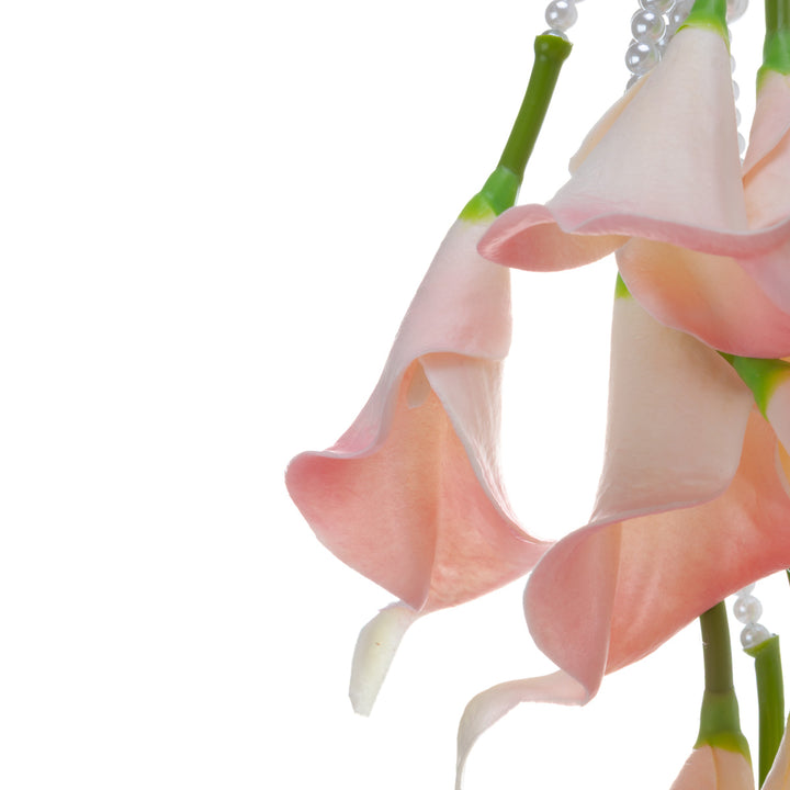 A calla lily bridal bouquet with a peach-colored artificial flower