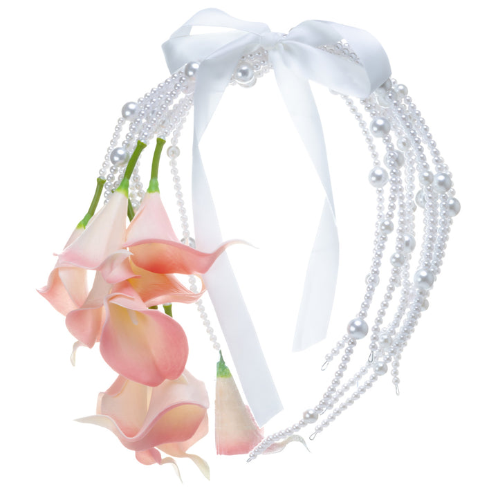A calla lily bridal bouquet with a peach-colored artificial flower